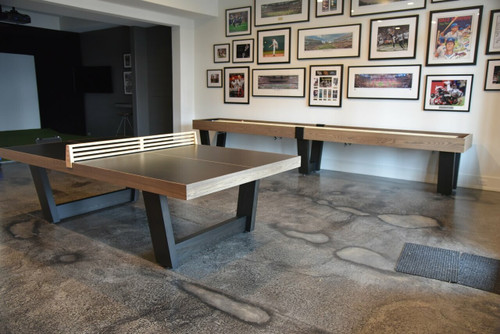 Monaco Luxury Ping Pong Table by Venture, crafted from solid Ash wood with a sleek black super matte playfield. Designed for modern interiors, this handcrafted table blends tournament-level precision with a minimalist aesthetic. Shown in a high-end game room with contemporary décor, highlighting its versatile design and seamless integration into luxury spaces.