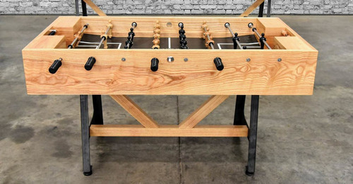 The Astoria Industrial Modern Foosball Table by Venture, a handcrafted centerpiece built for serious play and bold design. Featuring solid hardwood construction and commanding cold-rolled steel legs, this foosball table merges rugged industrial style with expert craftsmanship. Available exclusively at Sawyer Twain.