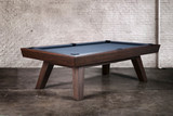 Captured in the photo shoot, the George Pool Table in Antique Coffee Finish by Doc & Holliday Billiards showcases its 1-inch Brazilian slate surface and K66 tournament cushions, offering a professional playing experience. The elegant finish and exceptional craftsmanship make it the centerpiece of any luxury game room, exclusively available at Sawyer Twain.