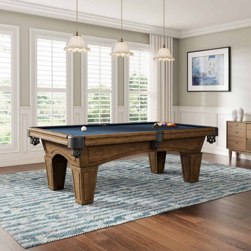 The Bearski Slate Pool Table is staged in a luxury game room, shown from an angled perspective to highlight its presence and how it fits into a designer space. This image emphasizes the Riverbank finish and elevates the ambiance of high-end home entertainment settings.