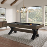 Nichols contemporary industrial pool table by Plank & Hide featuring bold steel X-shaped legs and rustic wood rails, styled in a modern living room with large windows and natural light.