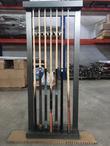 Vox Steel Wall Rack by Plank & Hide mounted on wall beside matching Vox Slate Pool Table. Industrial steel design in gunmetal grey, holds 8 cues.