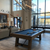 Isaac Slate Pool Table in Silvered Ash featured in a professionally styled modern living space. The soft wood tones and industrial accents make this a centerpiece for elevated home entertainment.
